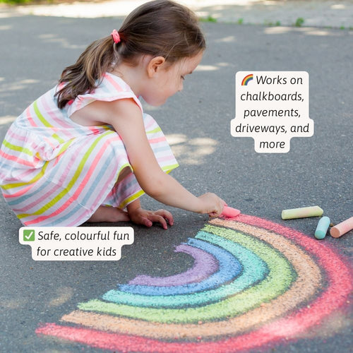 Child drawing a rainbow with sidewalk chalk on a pavement. 