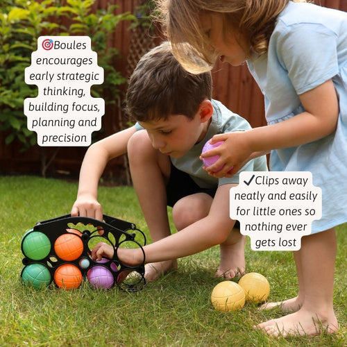 Two children playing with colorful balls on grass, with text about boules game benefits. 