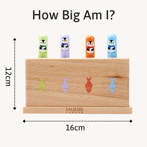 Wooden toy with colorful penguin figures and fish shapes, labeled 'How Big Am I?' by Jacques London. 