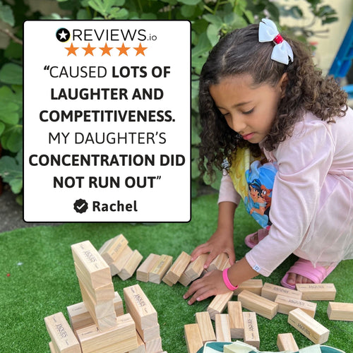 Girl playing wooden tumble tower garden game with customer review quote overlay 
