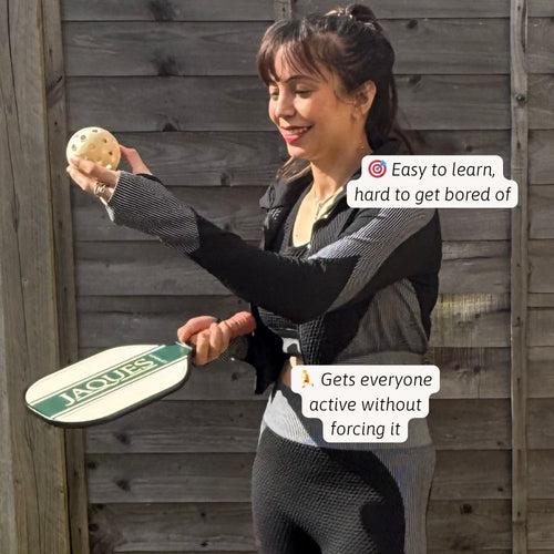 Woman holding a pickleball and paddle with text overlay against a wooden background 