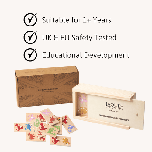 Wooden dinosaur dominoes set with packaging and Jaques of London branding, featuring safety and educational attributes. 