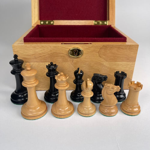 Chess pieces with a wooden box on a white background 