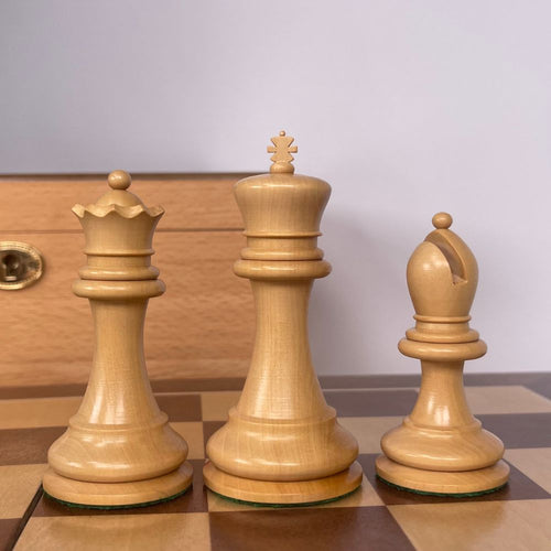 Close up of three white chess pieces on chess board. 