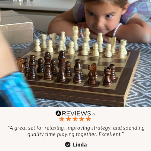 A close-up of a child looking at a wooden chessboard with chess pieces arranged, showing the detailed wooden pieces and board surface. 
