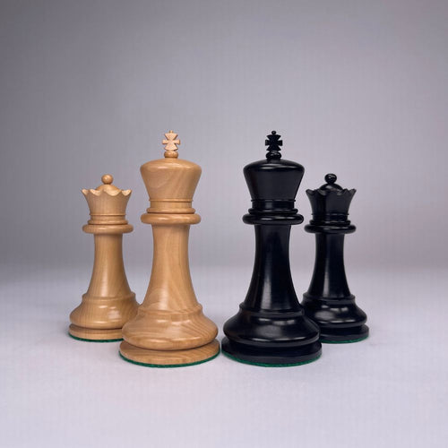 Set of wooden chess pieces on a gray background 