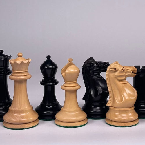 Set of large wooden chess pieces on a light gray background 