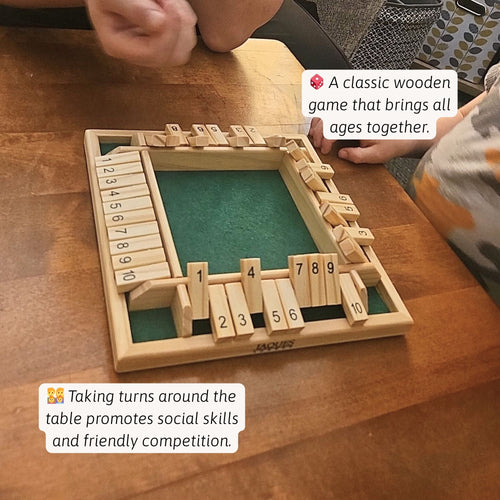 Close-up of a wooden shut-the-box game on a wooden table mid-play, with number tiles partially flipped down and text describing it as a classic game that brings all ages together and promotes social skills. 