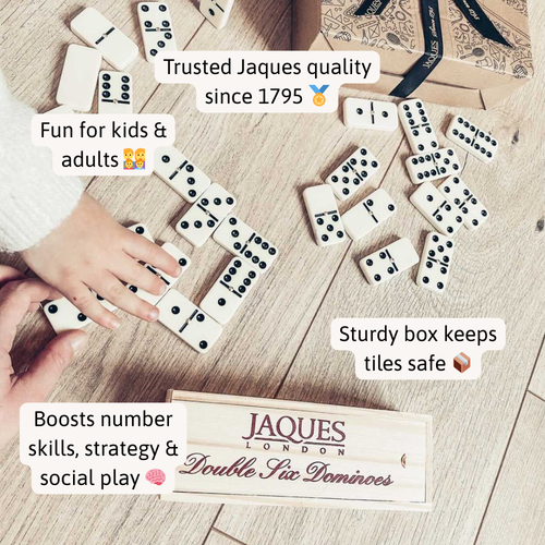 Dominoes set with hands playing and Jaques London branding on a wooden surface 