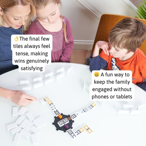 Family playing Mexican Train dominoes game on a tabletop 