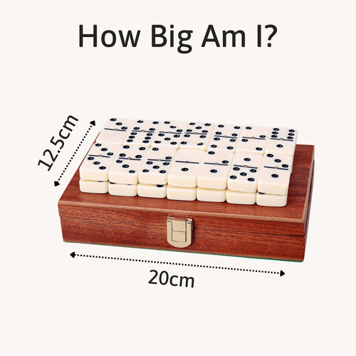 Compact dominoes set with mahogany box, measuring 20cm x 12.5cm. 