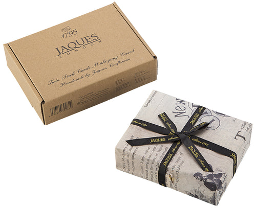 Product packaging and cards wrapped in Jaques tissue paper and a ribbon