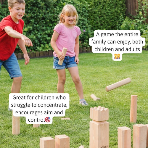 Children playing Kubb outdoor throwing game in the garden 