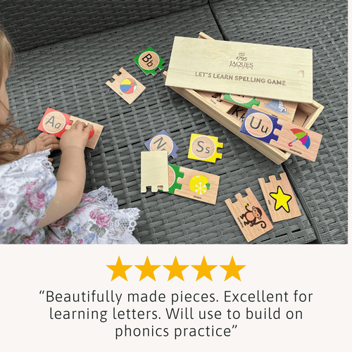 Child playing with educational spelling game pieces on a textured surface 