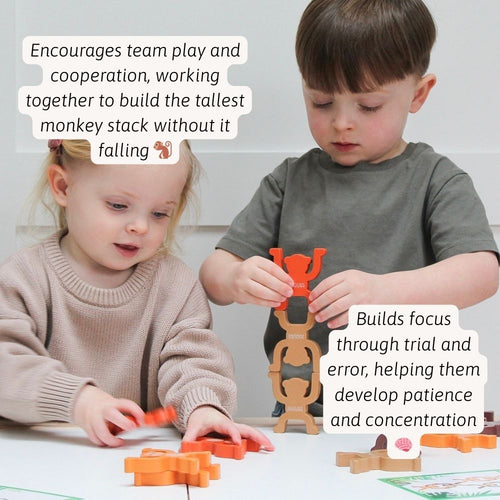 Children working together to stack the monkeys as high as they can 