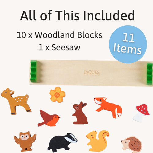 Wooden toy set with 10 woodland blocks and 1 seesaw, featuring Jaques branding. 