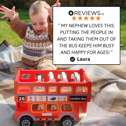 Lifestyle image of a smiling child playing outdoors with the red London bus toy, featuring a five-star customer review about the toy keeping children happily engaged. 