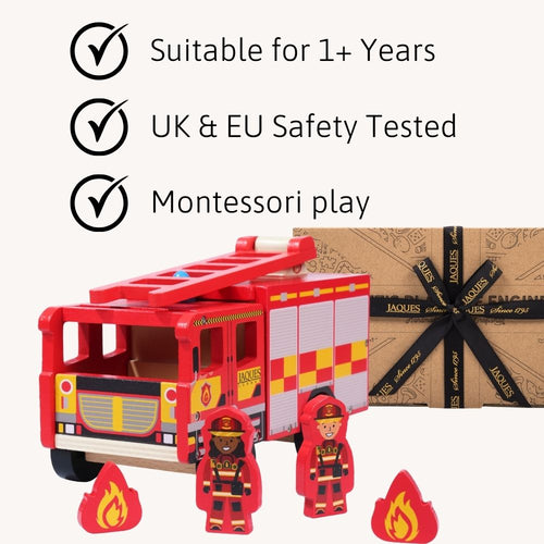 Toy fire truck with fireman figures and safety certification text on a white background. 