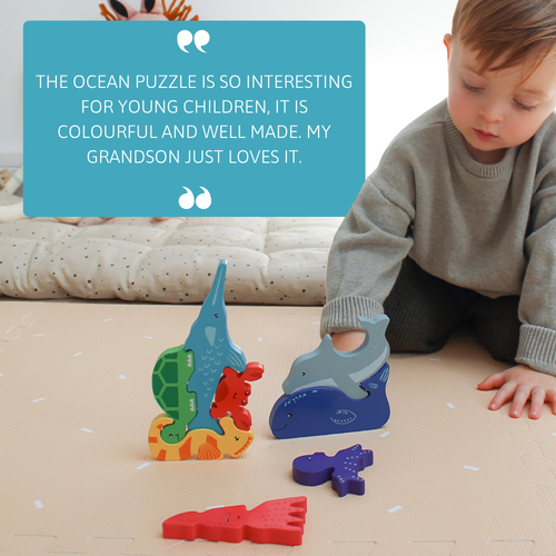 Child playing with brightly coloured wooden ocean animals arranged in a stack, with a large customer review quote displayed above 