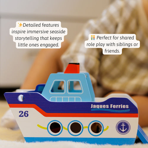 Close-up side view of the wooden boat highlighting the painted portholes, lifebuoy graphic, smooth wooden wheels underneath, and layered blue and white body design. 