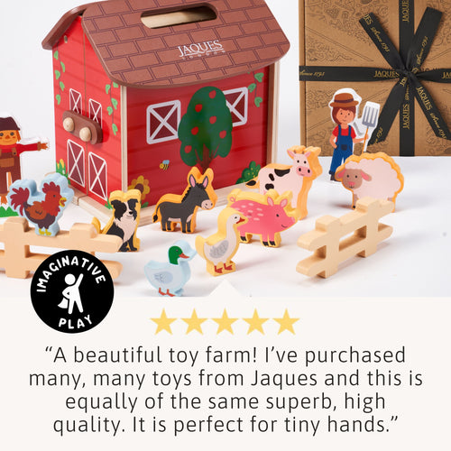 Wooden toy farm set with animals and barn, featuring Jaques branding.
