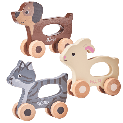 Three wooden animal toys with wheels on a transparent background, featuring the brand 'Jaques'. [fill]