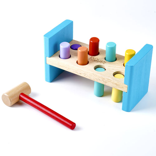 Colourful wooden hammering bench with red hammer 
