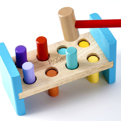 Colourful wooden hammering bench with pegs 