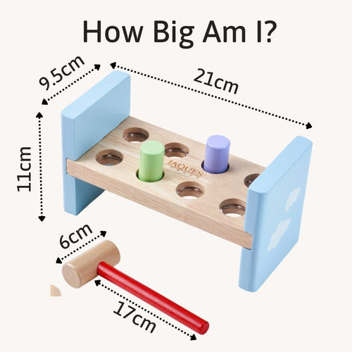 Wooden toy with dimensions labeled, including a hammer, on a white background.