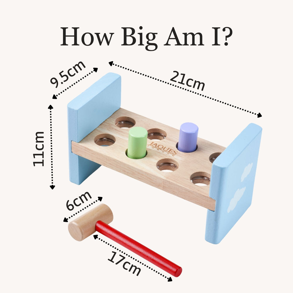 Wooden toy with dimensions labelled on a white background