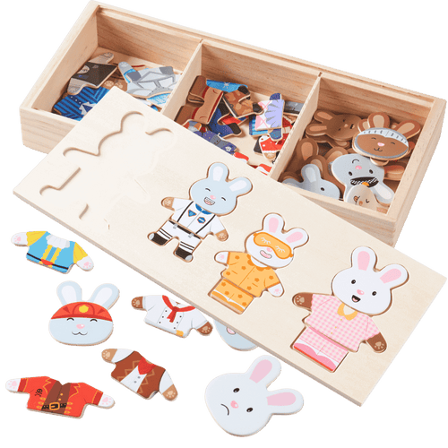 Wooden puzzle with rabbit figures and clothing pieces in a box [fill]