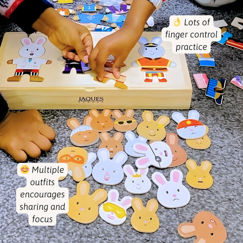 Children's puzzle with rabbit figures and wooden box labeled 'Jaques'. 
