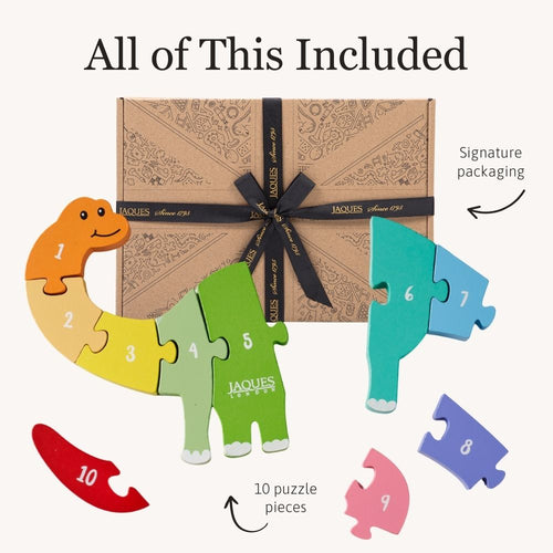 Dinosaur-shaped puzzle with numbered pieces and a decorative box on a white background. 