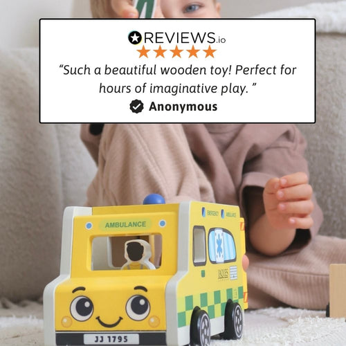 Child playing with a wooden ambulance toy, encouraging imaginative play and storytelling. 