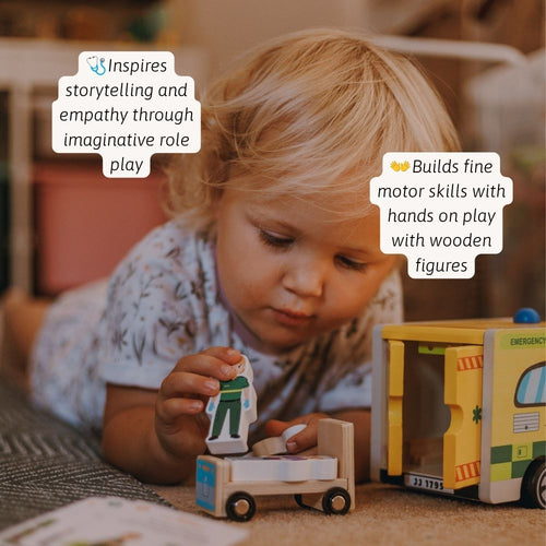 Child playing with a wooden ambulance toy and accessories, developing emotional awareness and language skills. 