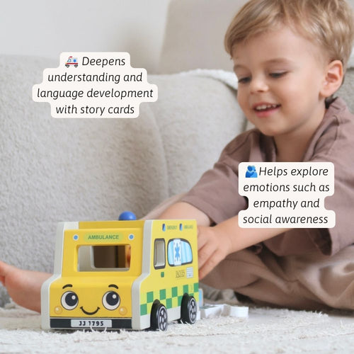 Child playing with a wooden ambulance toy and figures, encouraging empathy, storytelling and fine motor skills. 