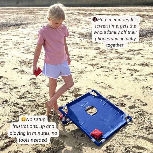 Child pulling the portable blue cornhole board across the beach using the attached carry rope. 