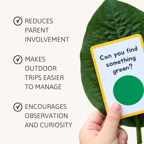 Hand holding a card with a green circle and text on a leaf background