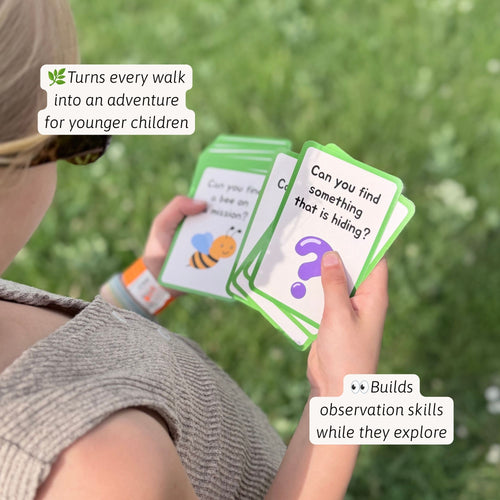 Jaques of London Nature Scavenger Hunt Game - child reading a scavenger hunt clue card asking them to find something hiding in nature, 
