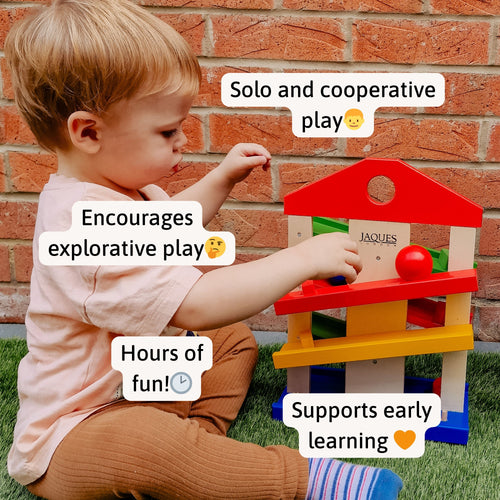 “Little boy enjoying Jaques of London wooden ramp toy outdoors – supports early learning, explorative play, and hours of engaging fun. [filll]