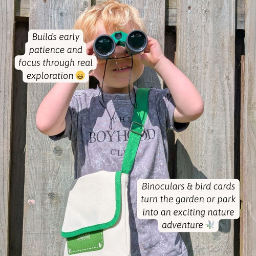 A child using binoculars to spot birds and explore nature up close 