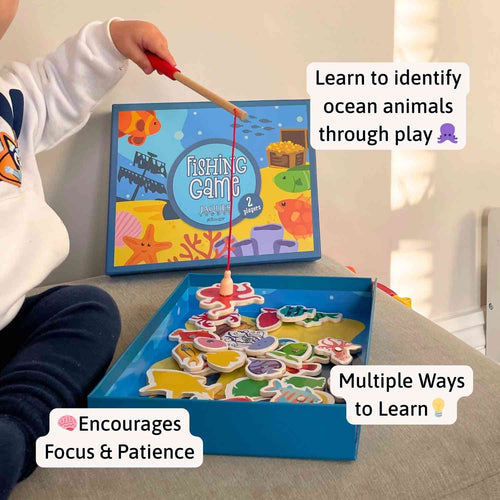 Child playing with a fishing game toy, encouraging ocean animal identification and focus/patience. 
