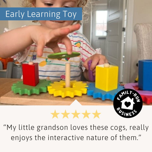 Toddler playing with Jaques of London colourful wooden gear puzzle – interactive cogs promote fine motor skills, curiosity, and early learning play. [filll]