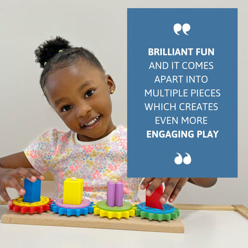 Smiling child playing with Jaques of London wooden gear puzzle – multiple detachable pieces create engaging, hands-on play for early learners. [filll]