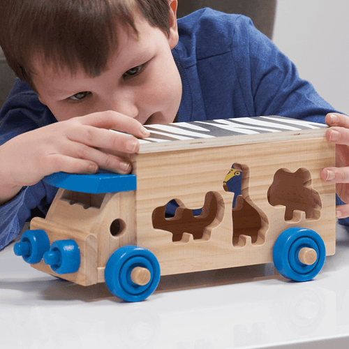  zoomed in image of boy playing with toy 
