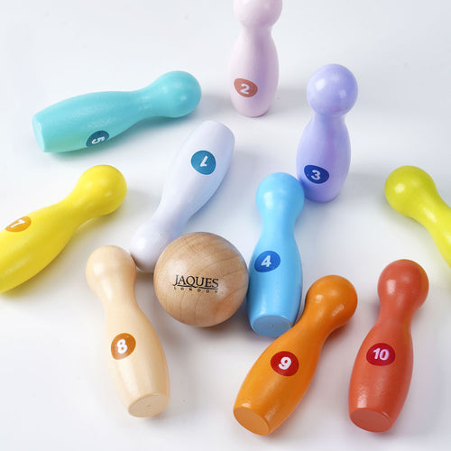 Colourful wooden baby skittles knocked down 