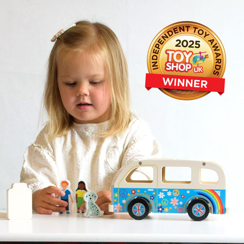 Kids wooden campervan with surfboard and luggage 