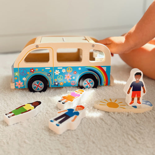 Kids wooden campervan with surfboard and luggage 