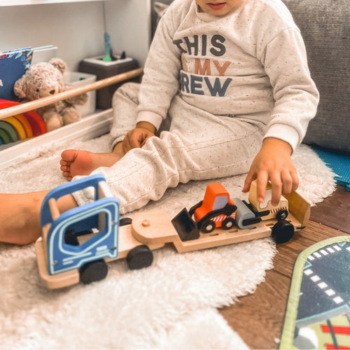  Child_pushing_construction_vehicle_toy