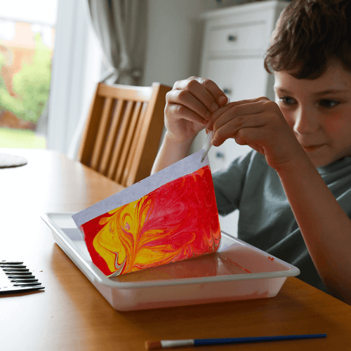   Child using marble art set 
